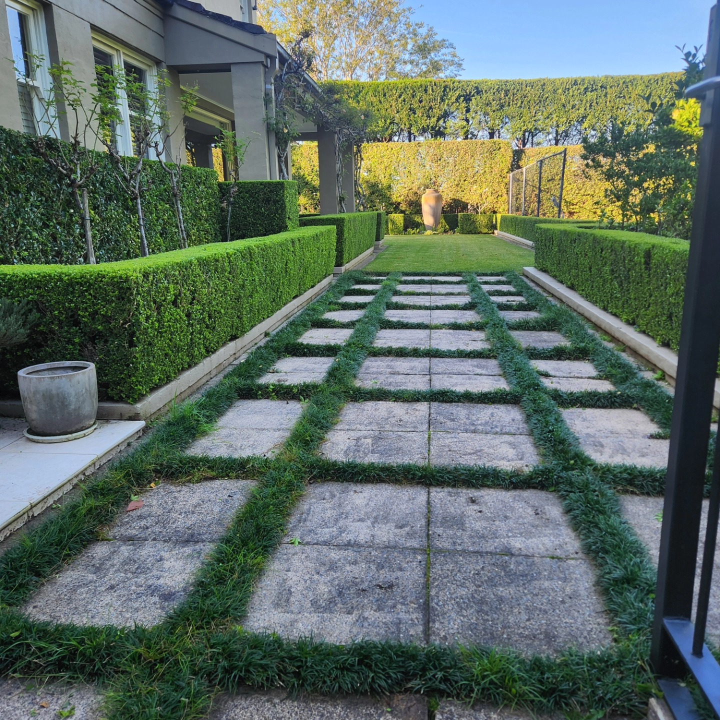 Immaculate formal estate garden with stepping stone path — Upper North Shore