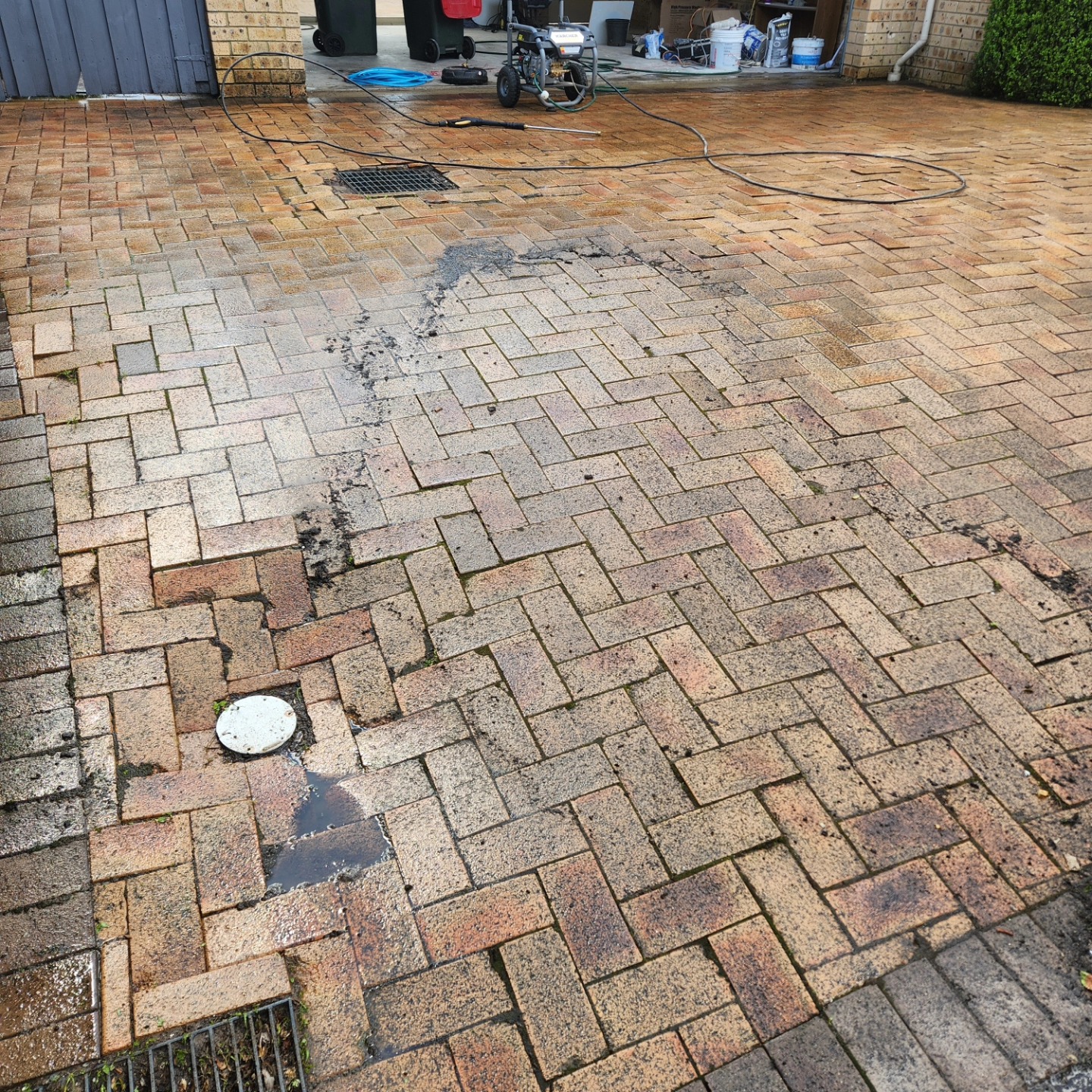 Dirty brick paver driveway before pressure washing — Sydney